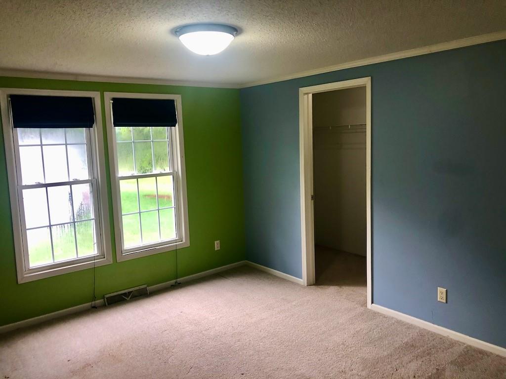 340 Ridge Road Mocksville, NC 27028 - Photo 21 of 22 a view of an empty room with a window