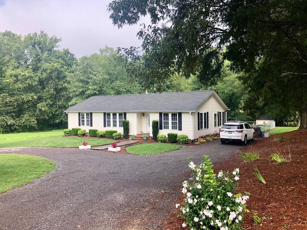 340 Ridge Road Mocksville, NC 27028 - Photo 4 of 22 a front view of a house with garden