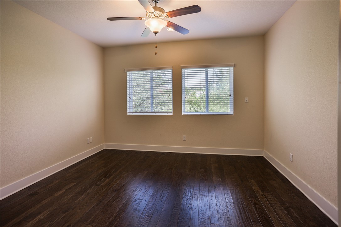 825 Clear Stream Crossing Austin, TX 78753 - Photo 30 of 34 wooden floor in an empty room with a window