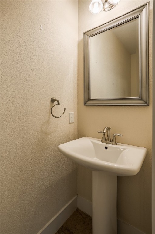 825 Clear Stream Crossing Austin, TX 78753 - Photo 7 of 34 a bathroom with a sink and mirror