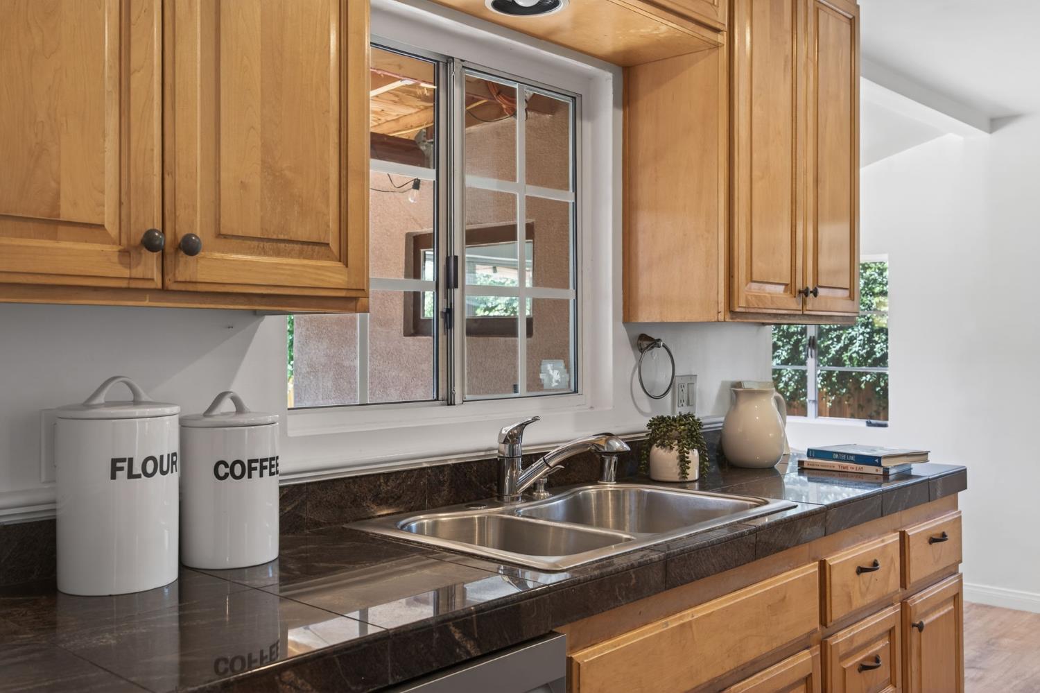 1054 Fairview Road Ojai, CA 93023 - Photo 18 of 33 a kitchen with a sink and cabinets