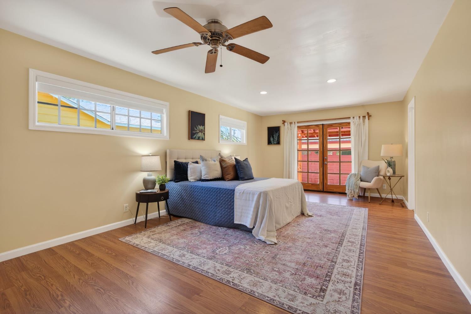 1054 Fairview Road Ojai, CA 93023 - Photo 21 of 33 a bedroom with a bed and a chandelier