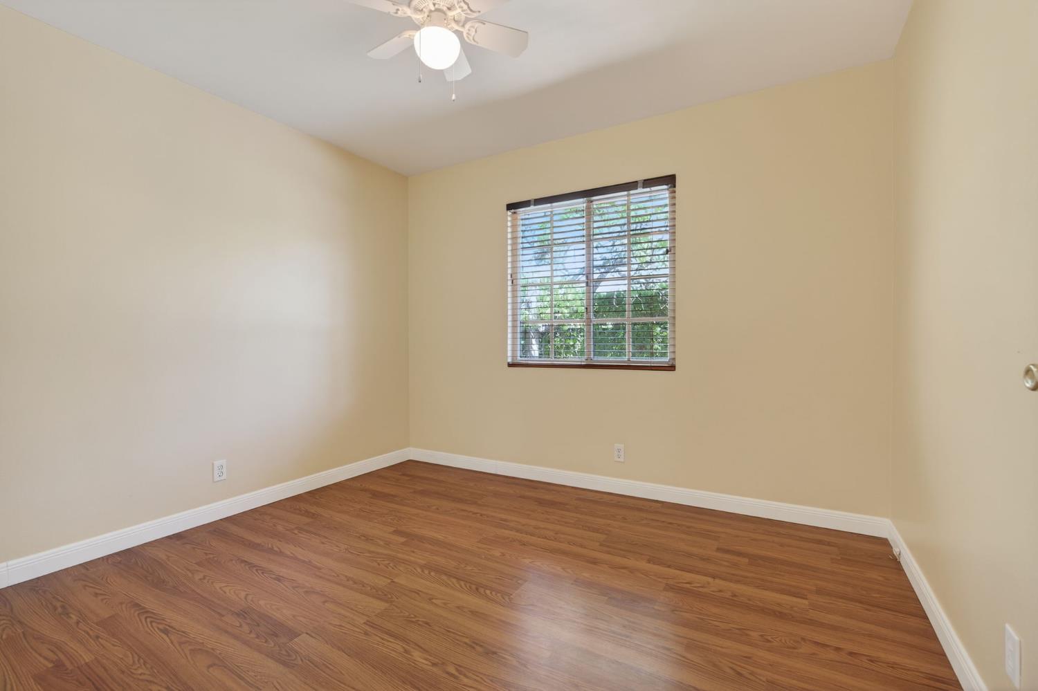 1054 Fairview Road Ojai, CA 93023 - Photo 28 of 33 an empty room with wooden floor and windows