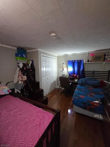 a room with furniture and a flat screen tv