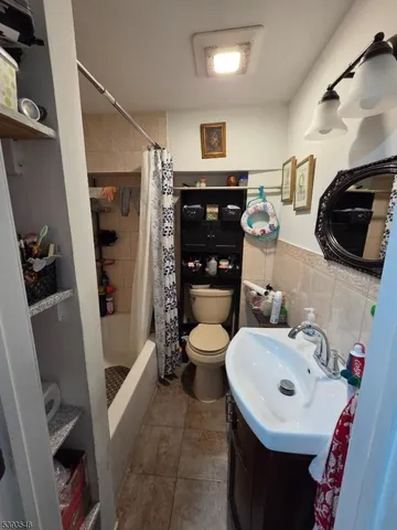 a bed room with a bed and a chair