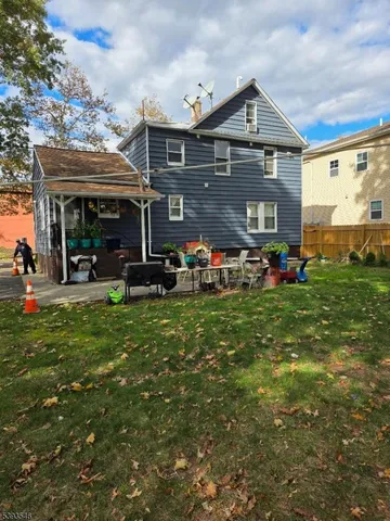a front view of a house with a big yard