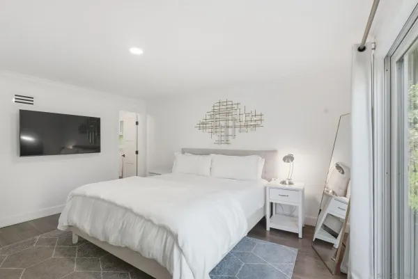 a living room with furniture rug and a large window