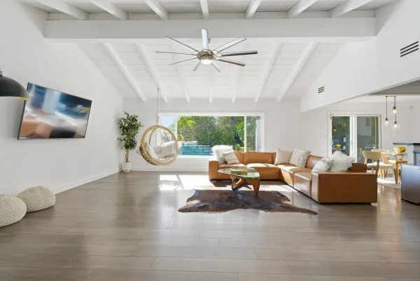 an aerial view of a house with garden space and street view