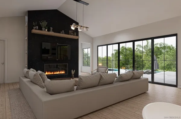a living room with stainless steel appliances kitchen island granite countertop furniture and a wooden floor