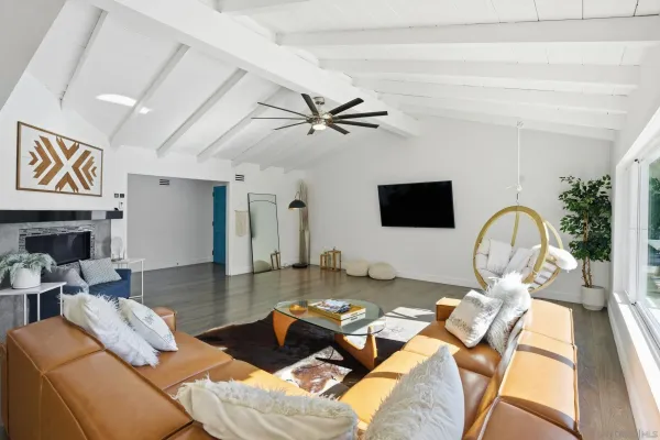 an aerial view of a house with a yard and garden