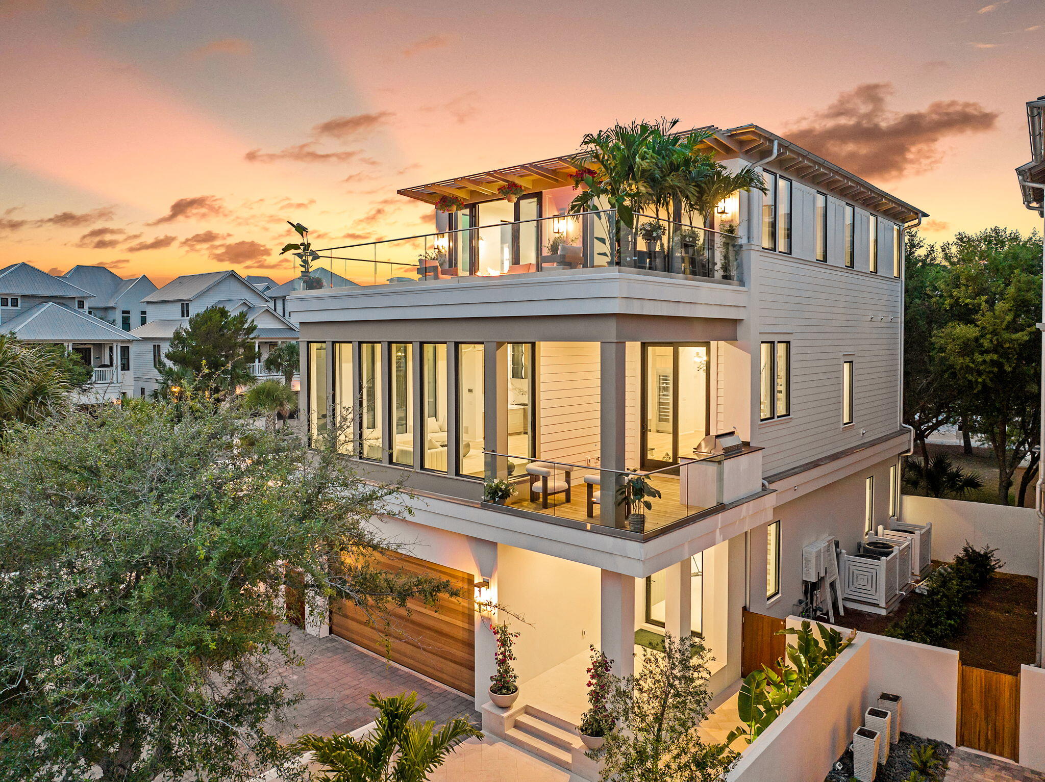 a front view of a house with large windows