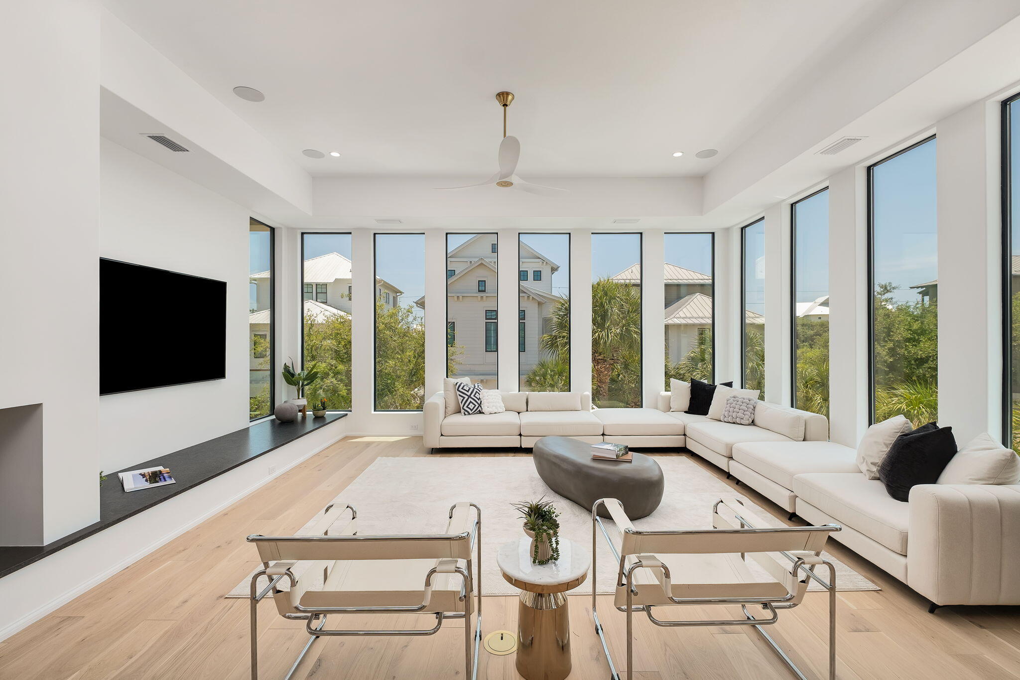 238 Sand Oaks Circle Santa Rosa Beach, FL 32459 - Photo 12 of 26 a living room with furniture a flat screen tv and a large window