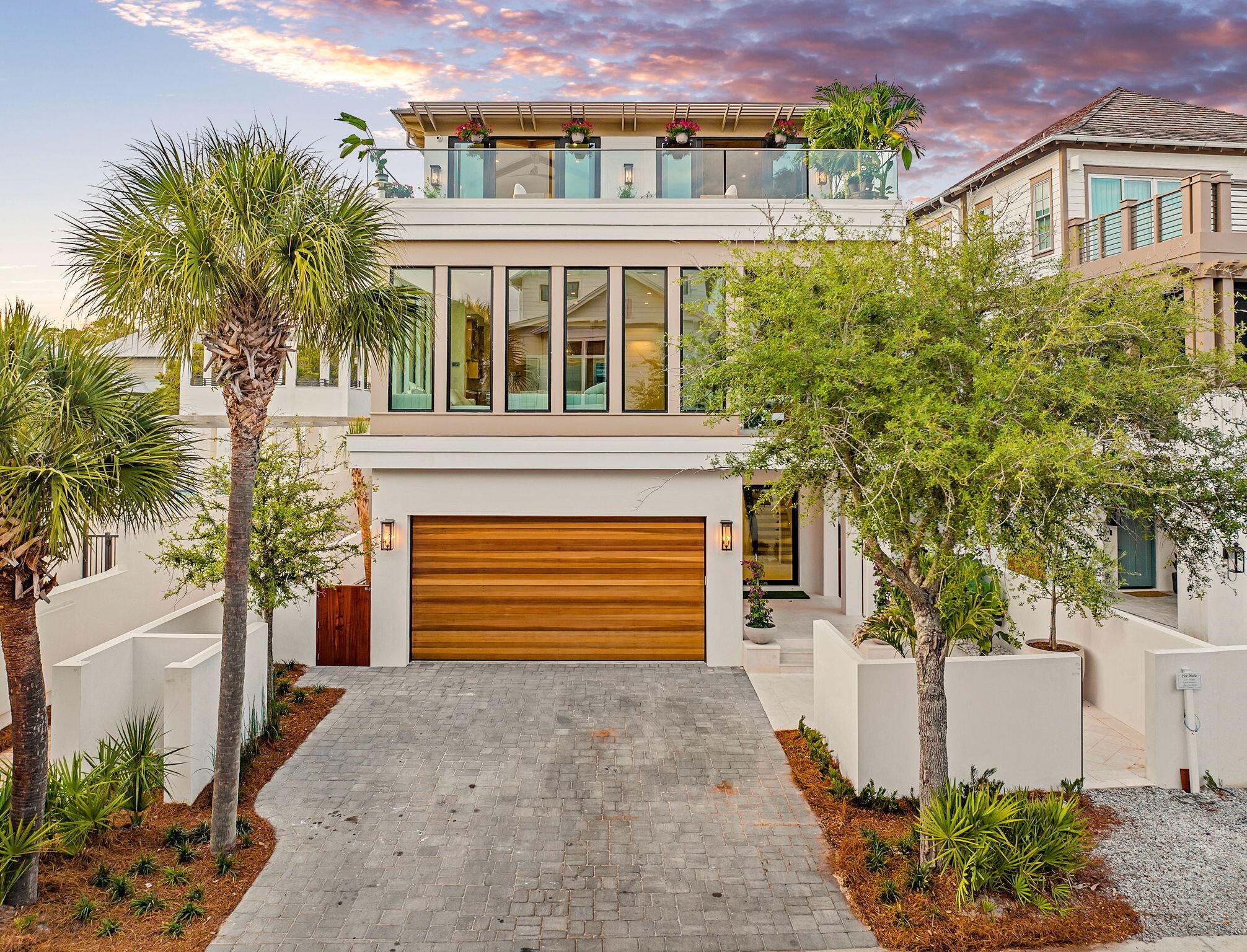 238 Sand Oaks Circle Santa Rosa Beach, FL 32459 - Photo 7 of 26 a front view of a house with a yard and garage