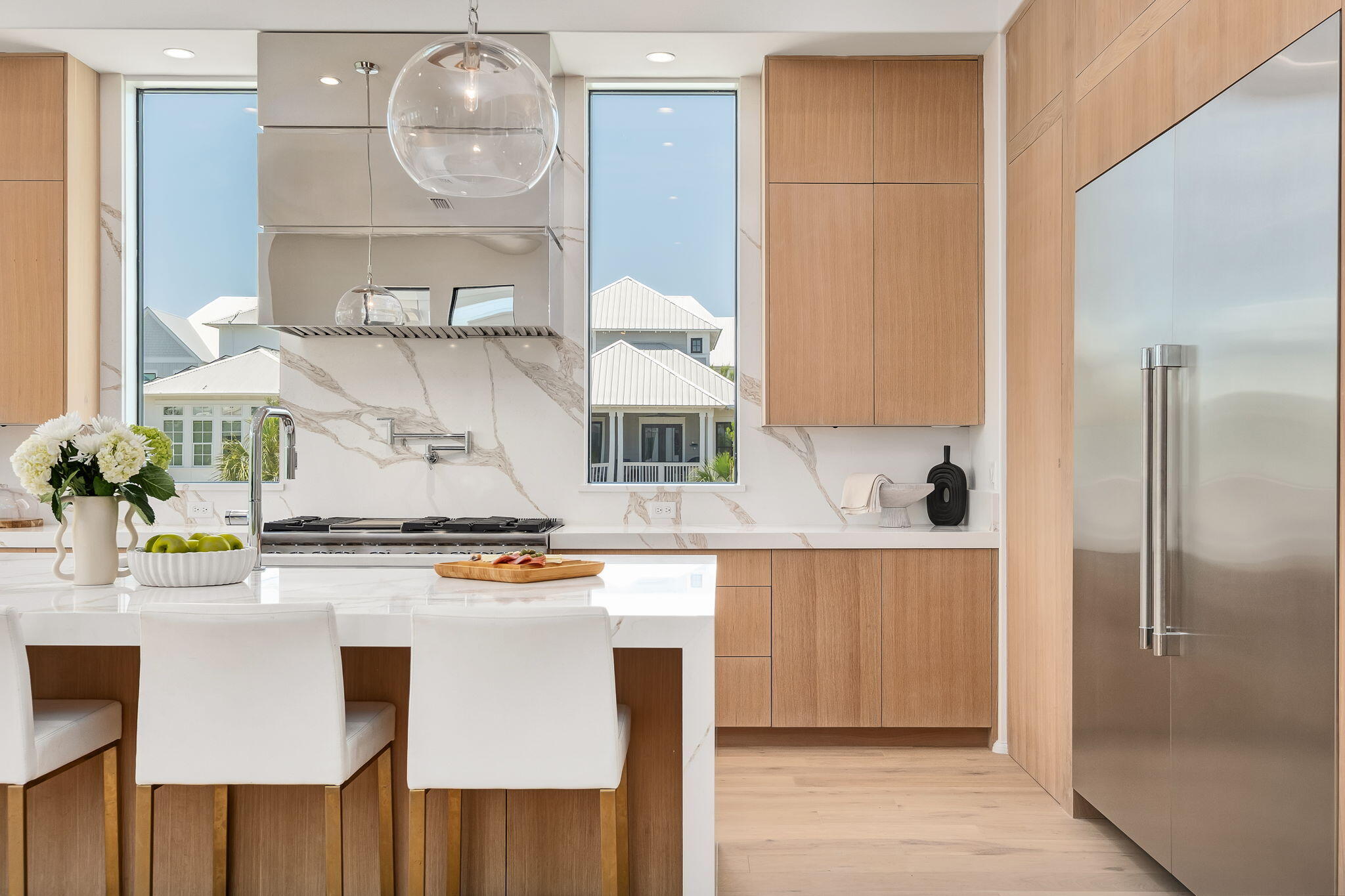 238 Sand Oaks Circle Santa Rosa Beach, FL 32459 - Photo 10 of 26 a kitchen with stainless steel appliances granite countertop a sink and a refrigerator