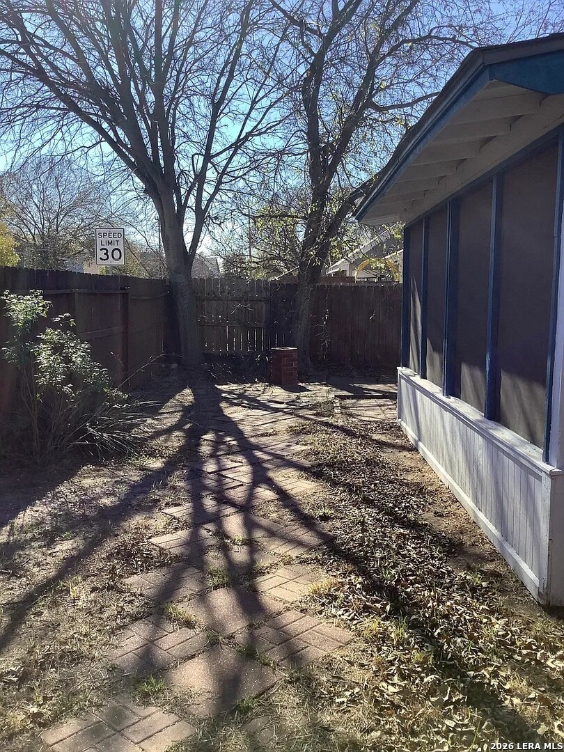 9502 Swans Crossing San Antonio, TX 78250 - Photo 14 of 17 a backyard of a house with lots of green space