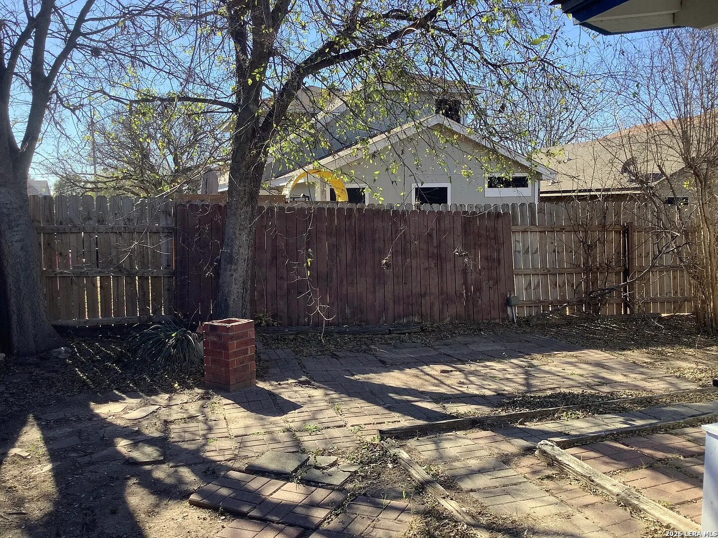 9502 Swans Crossing San Antonio, TX 78250 - Photo 15 of 17 a view of a house with a yard covered in snow