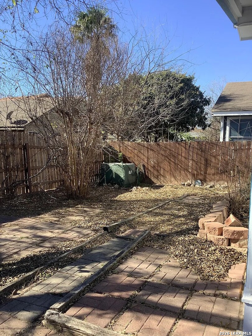 9502 Swans Crossing San Antonio, TX 78250 - Photo 17 of 17 a view of a yard with trees