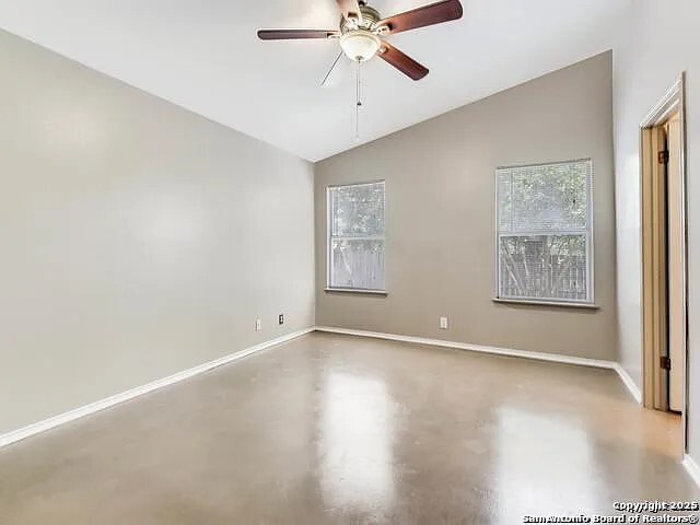 9502 Swans Crossing San Antonio, TX 78250 - Photo 4 of 17 wooden floor in an empty room with a window
