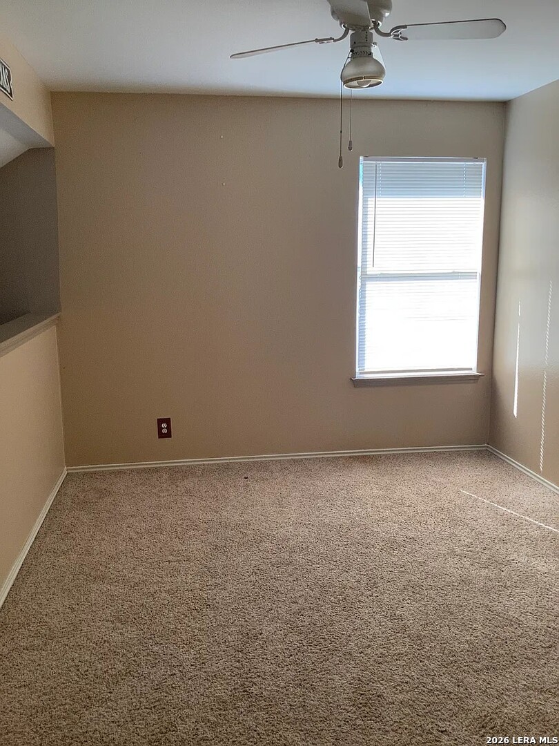 9502 Swans Crossing San Antonio, TX 78250 - Photo 10 of 17 an empty room with a window