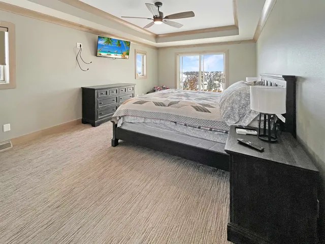 a bedroom with a bed and a table