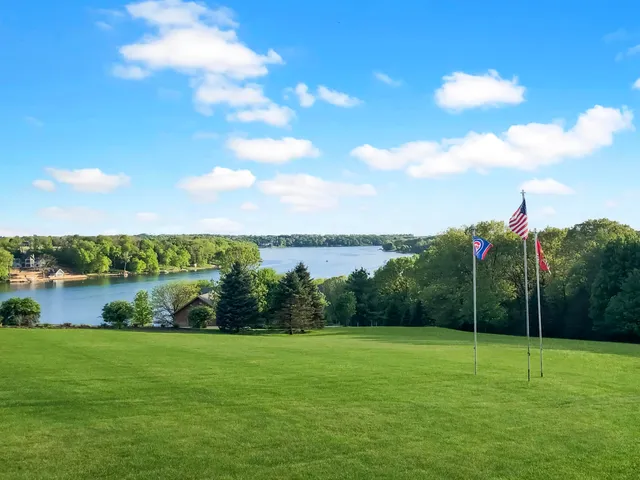 a view of a garden and lake