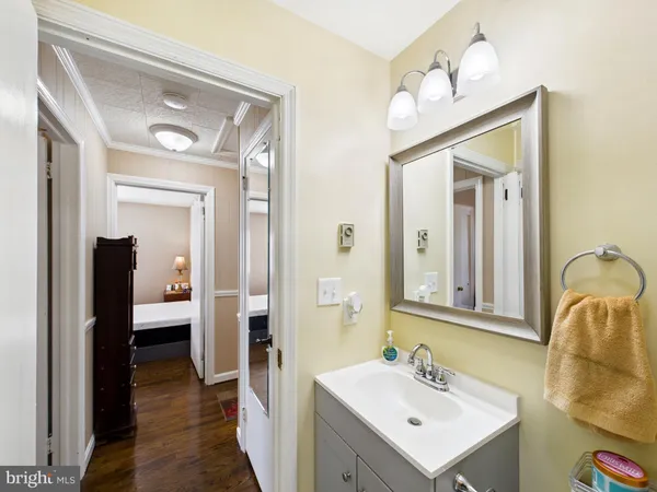 a bathroom with a sink a mirror and a shower