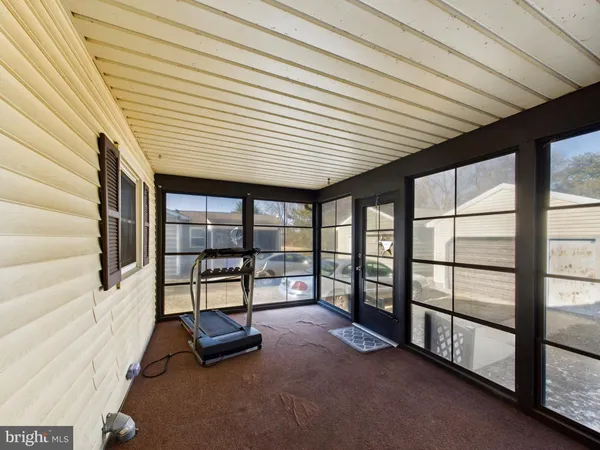 a view of balcony with couch and wooden floor