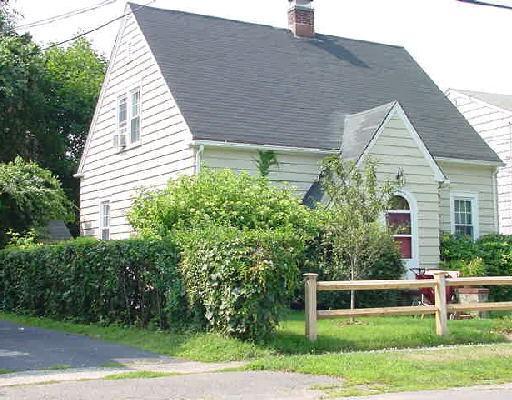 500 Riverside Drive Fairfield, CT 06824 - Photo 1 of 1 a backyard of a house with plants and garden