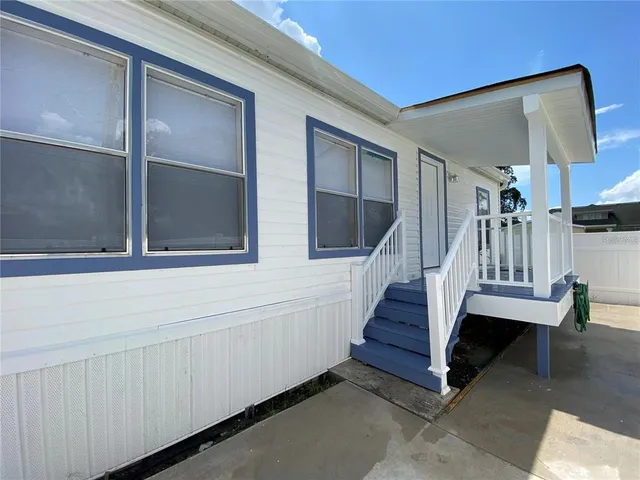 a view of entryway with wooden floor and stairs