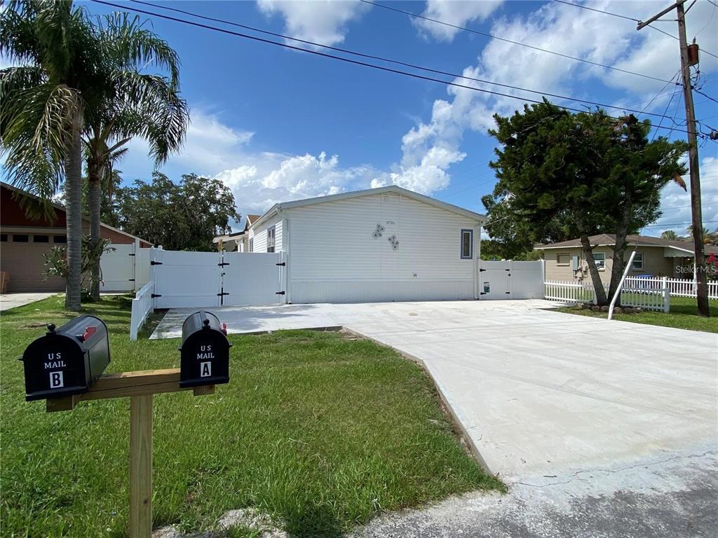 8726 Mayflower Road Tampa, FL 33615 - Photo 2 of 7 a house view with a garden space