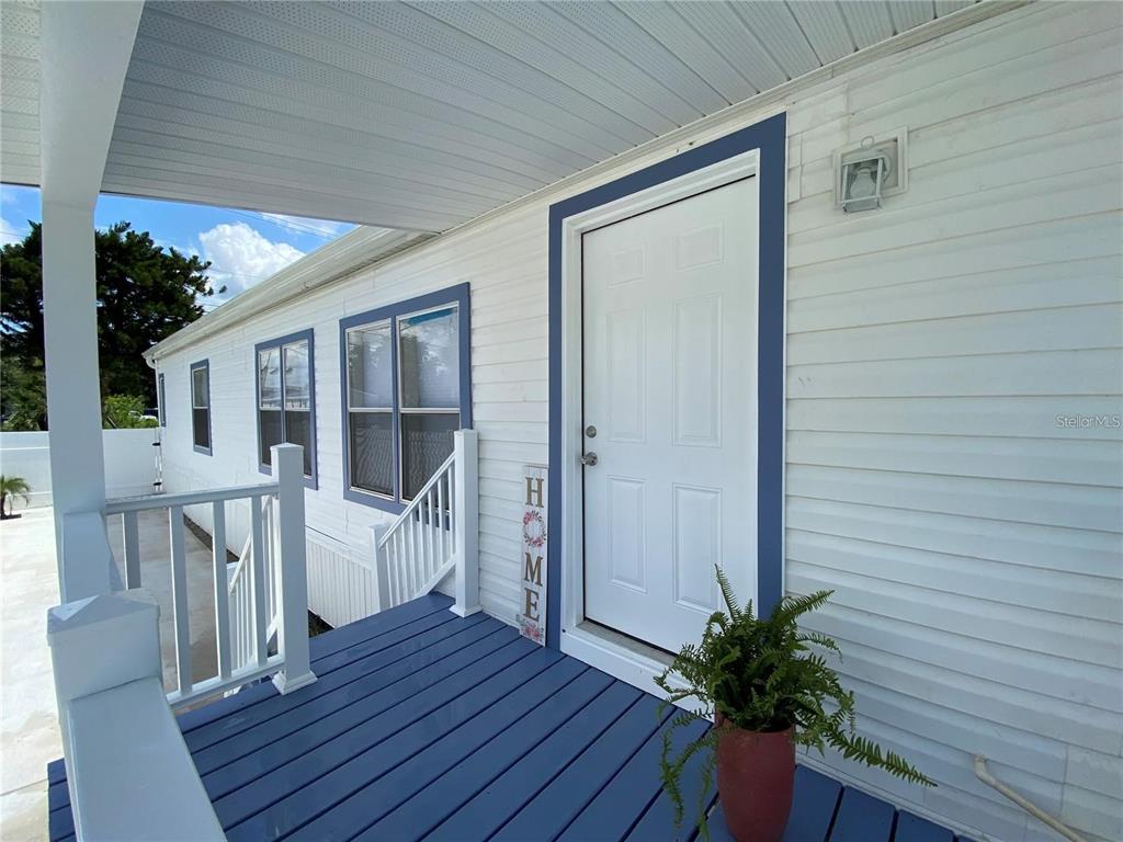 8726 Mayflower Road Tampa, FL 33615 - Photo 7 of 7 a view of deck with furniture and garden