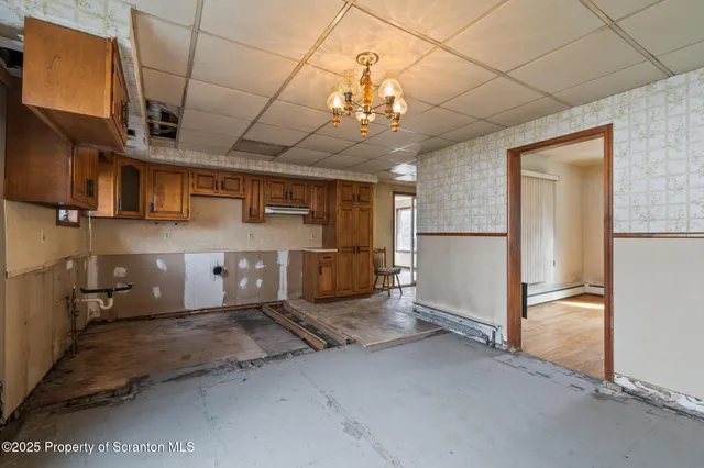 a view of hallway with seating area