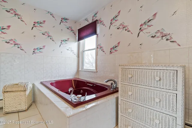 a bathroom with a toilet and a sink