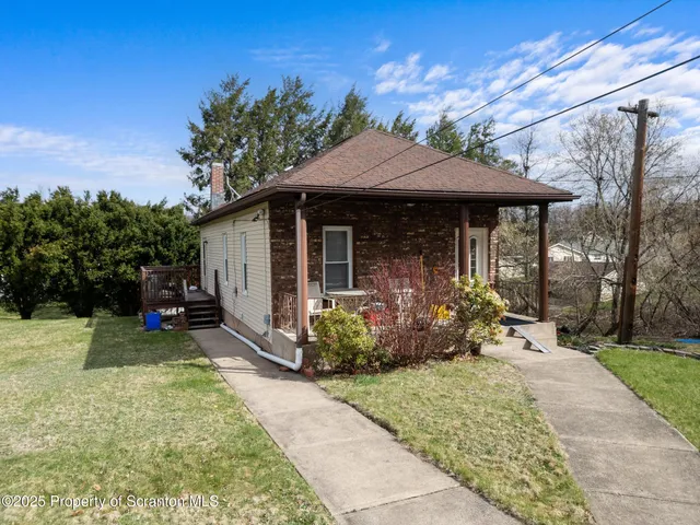 a kitchen with a table and chairs in it