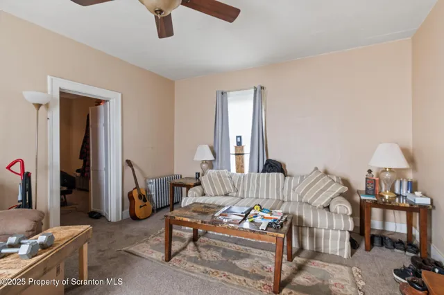 a bedroom with furniture and a chandelier