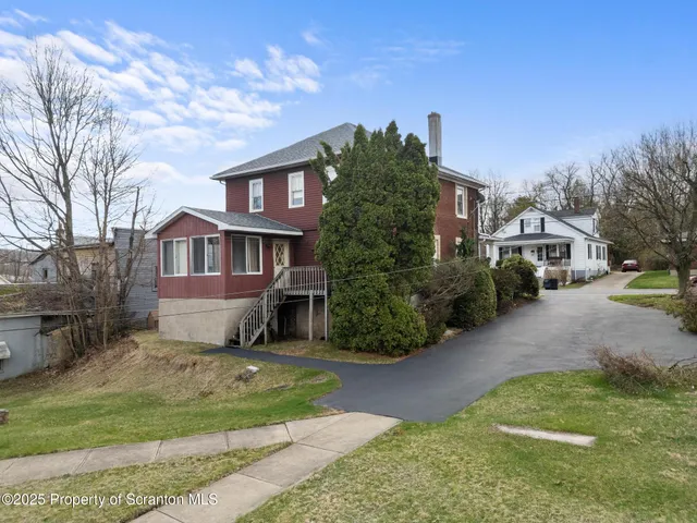 a front view of a house with a garage