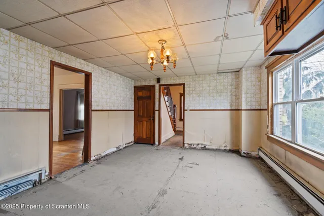 a view of a room with lot of windows