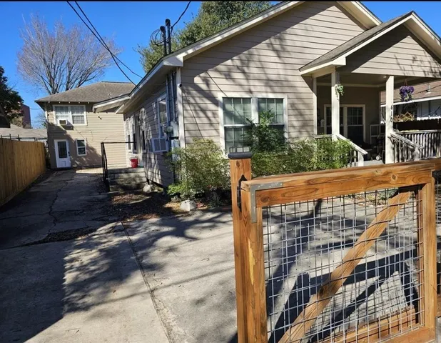 a bedroom with a bed dresser and a window