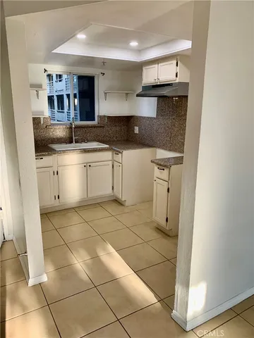a kitchen with stainless steel appliances granite countertop a sink and cabinets