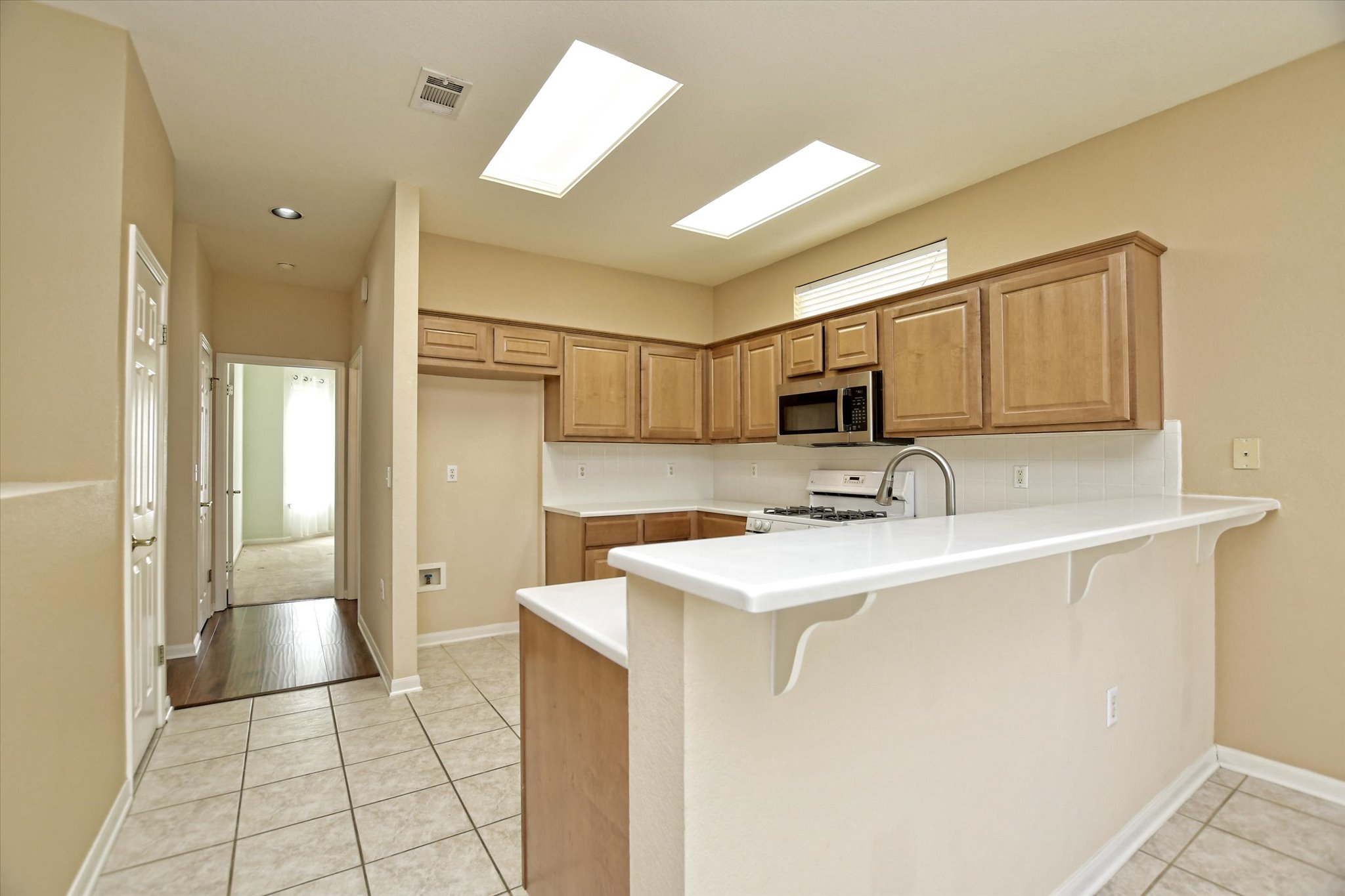 112 Bluebell Drive Georgetown, TX 78633 - Photo 13 of 23 a view of a sink a refrigerator and cabinets