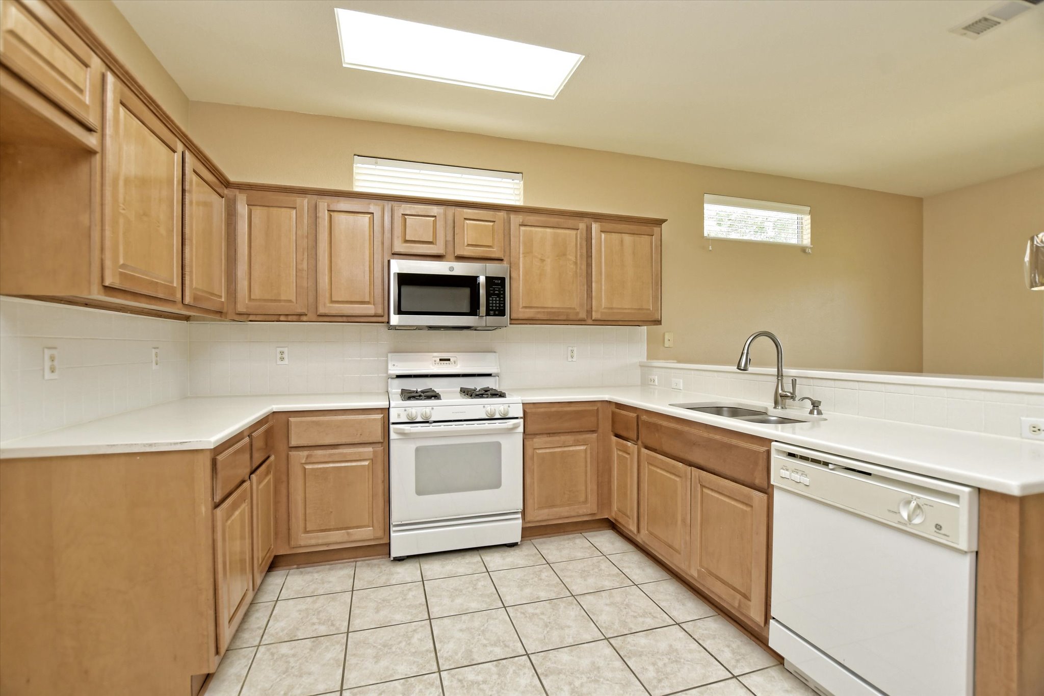 112 Bluebell Drive Georgetown, TX 78633 - Photo 14 of 23 a kitchen with cabinets appliances and a sink