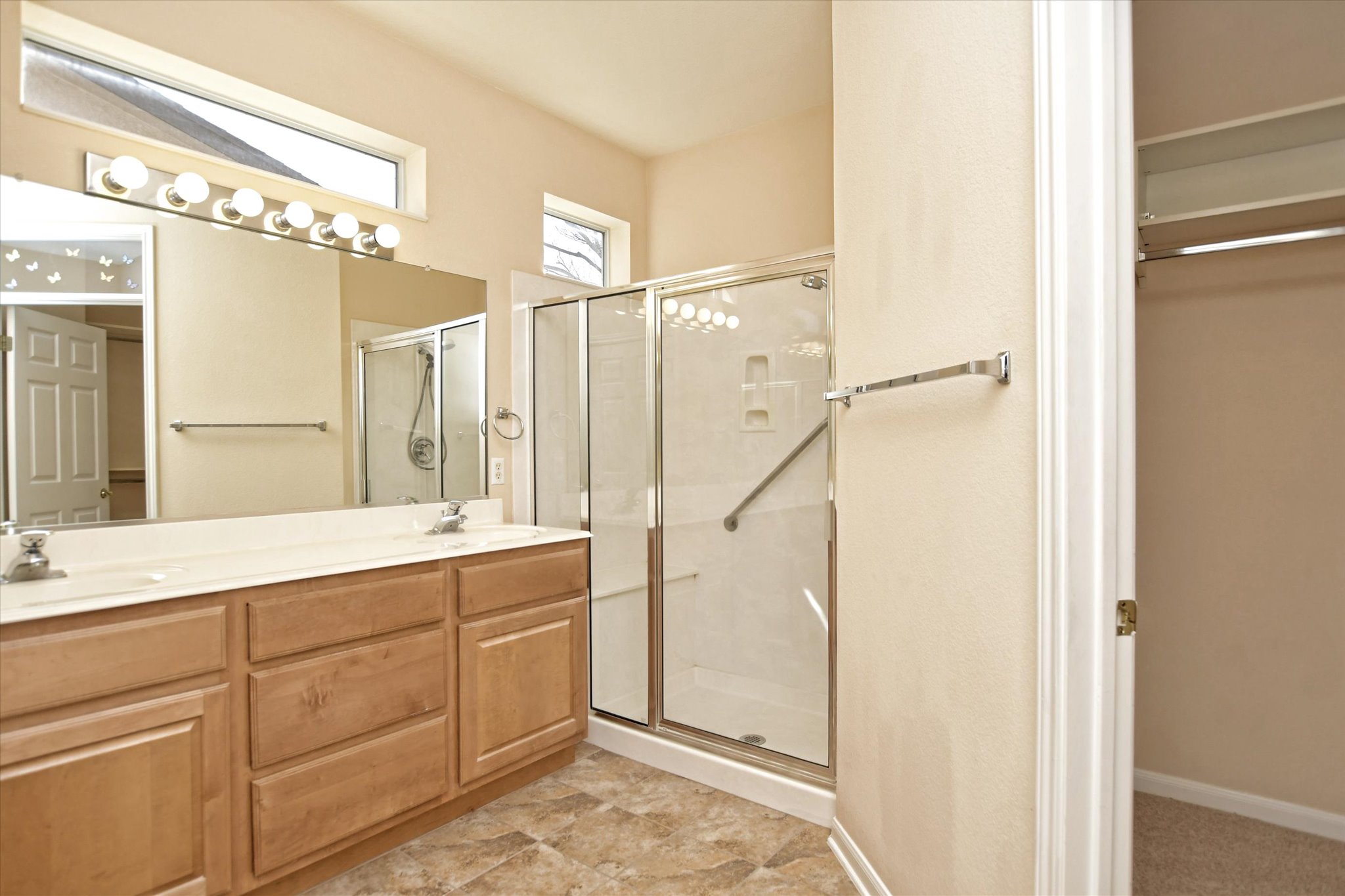 112 Bluebell Drive Georgetown, TX 78633 - Photo 20 of 23 a spacious bathroom with a double vanity sink a mirror and a shower