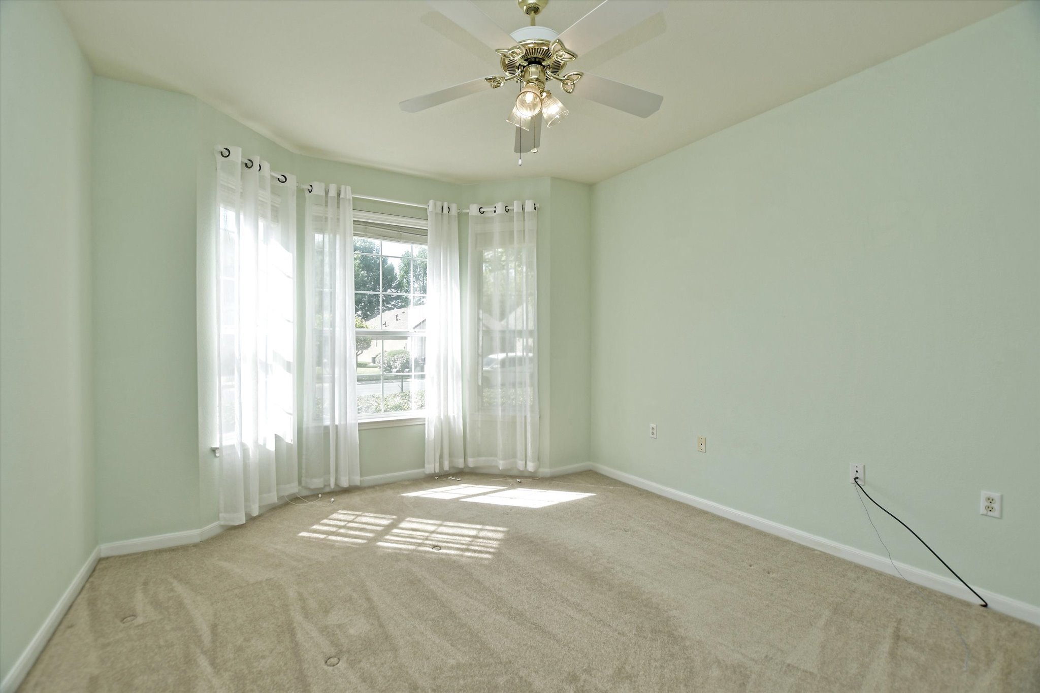 112 Bluebell Drive Georgetown, TX 78633 - Photo 22 of 23 a view of a big room with windows and chandelier fan