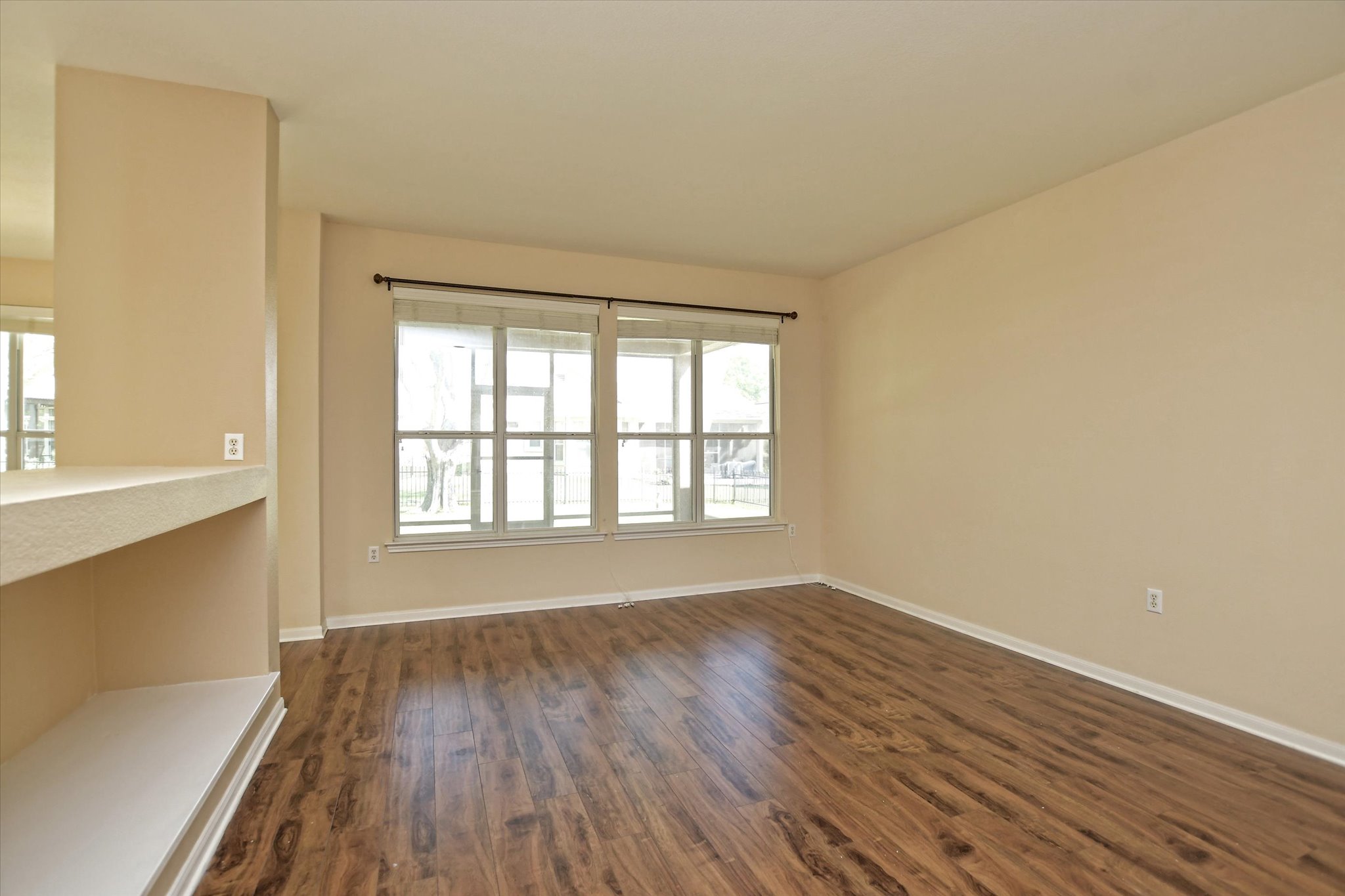 112 Bluebell Drive Georgetown, TX 78633 - Photo 8 of 23 a view of an empty room with wooden floor and a window