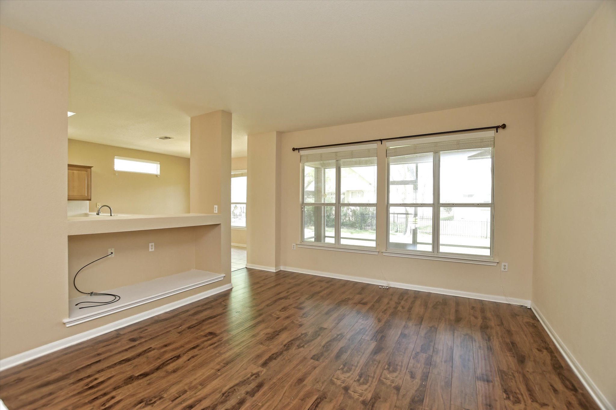 112 Bluebell Drive Georgetown, TX 78633 - Photo 9 of 23 a view of an empty room with a window and wooden floor
