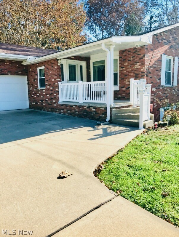 976 Braun Road Belpre, OH 45714 - Photo 3 of 48 FRONT PORCH WITH UPPER DRIVEWAY