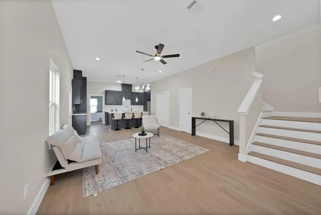 a living room with furniture and a large window