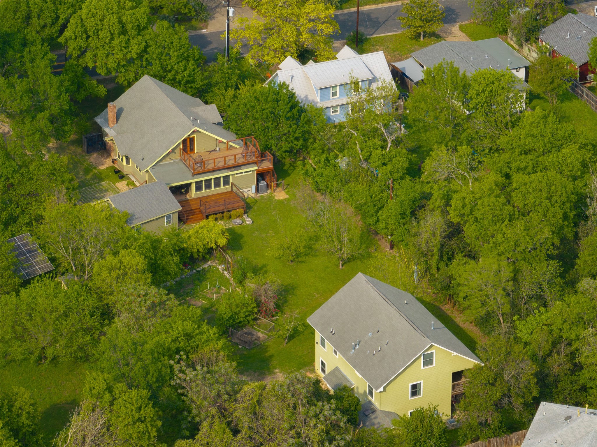 1917 Miles Avenue Austin, TX 78745 - Photo 1 of 39 an aerial view of house with yard and trees all around