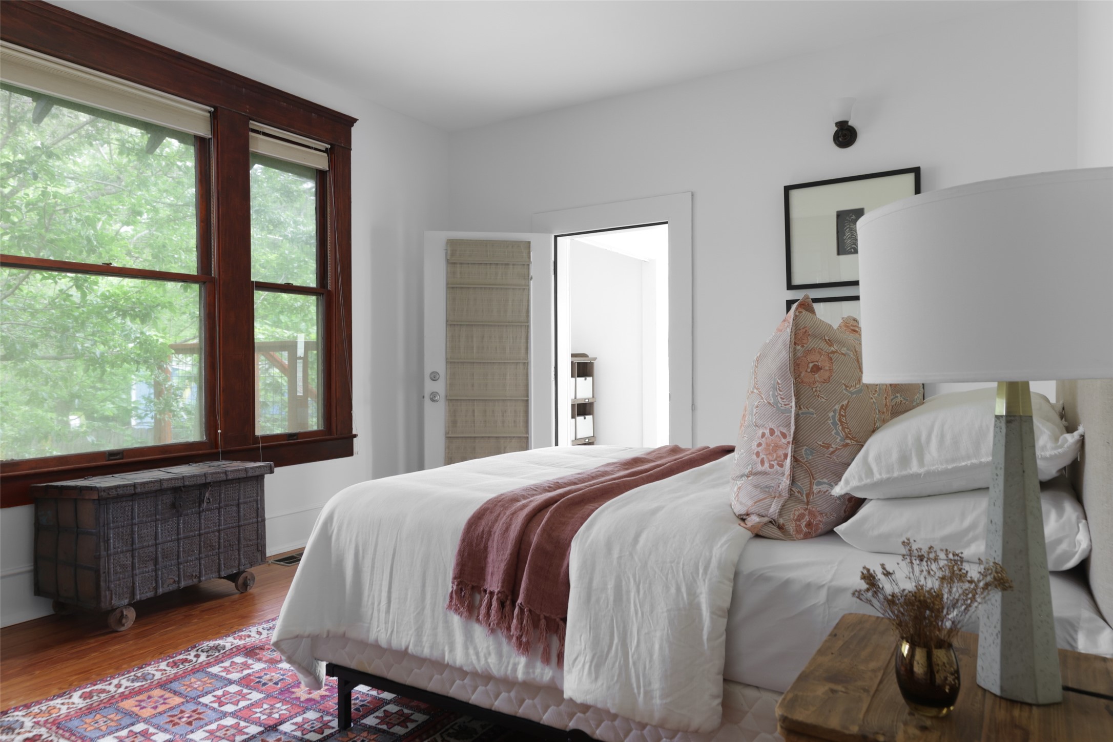 1917 Miles Avenue Austin, TX 78745 - Photo 18 of 39 a bedroom with a large bed and a large window