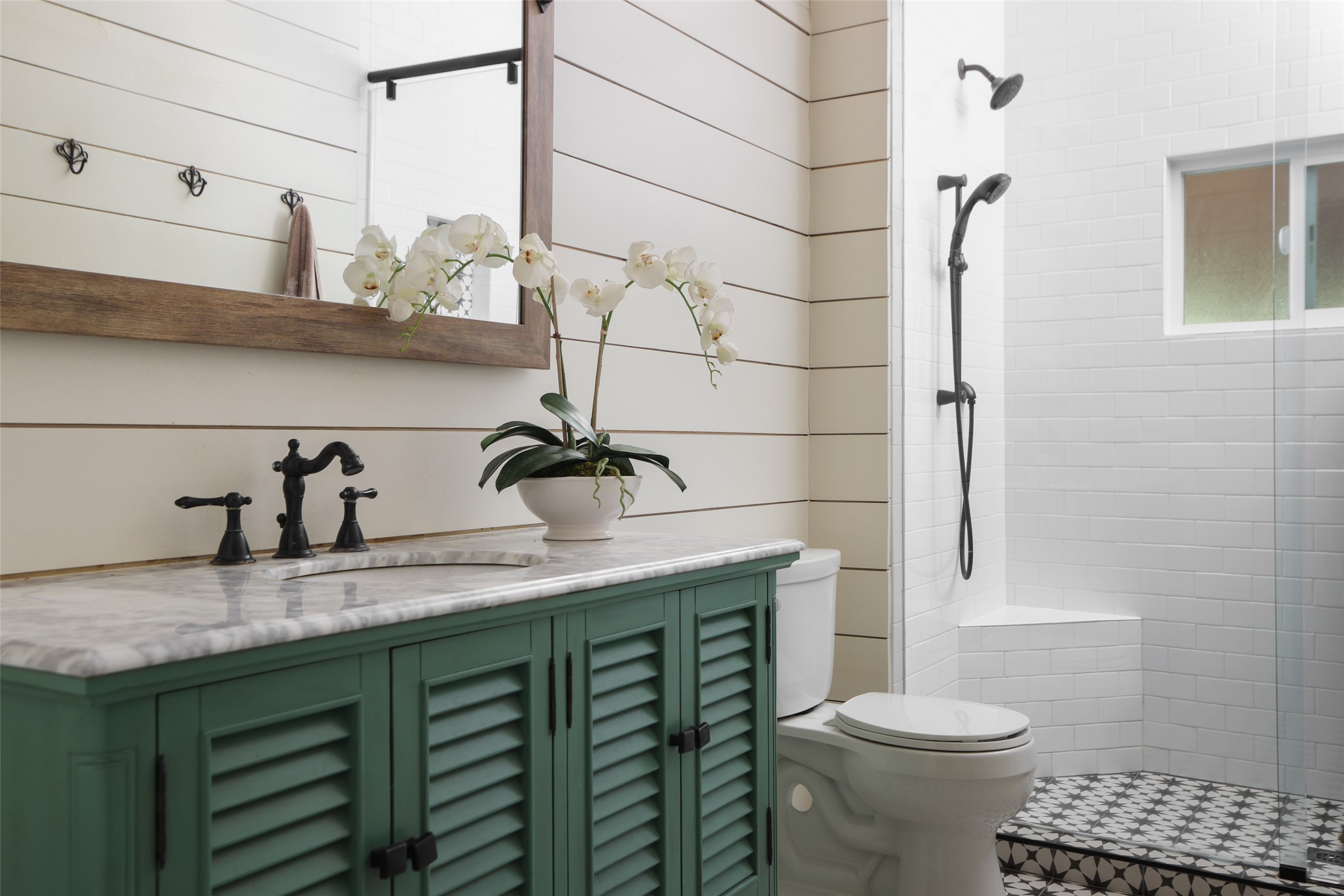 1917 Miles Avenue Austin, TX 78745 - Photo 21 of 39 a bathroom with a sink a toilet and shower